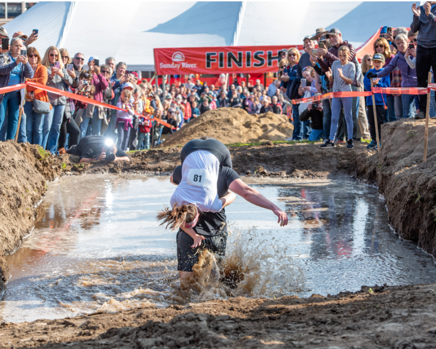 Wild American Wife Carrying Championship 2024: Beer, Cash, Mud, and Fun.