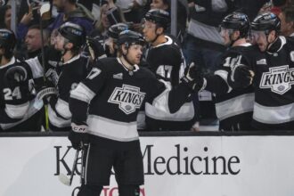 Kings glad to be back on home ice, beating Sharks after seven-game trip