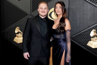 LOS ANGELES, CALIFORNIA - FEBRUARY 04: (FOR EDITORIAL USE ONLY) (L-R) Zach Bryan and Bri LaPaglia attend the 66th GRAMMY Awards at Crypto.com Arena on February 04, 2024 in Los Angeles, California. (Photo by Jeff Kravitz/FilmMagic)