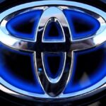 Scandal-hit car maker Toyota sees profits take a tumble