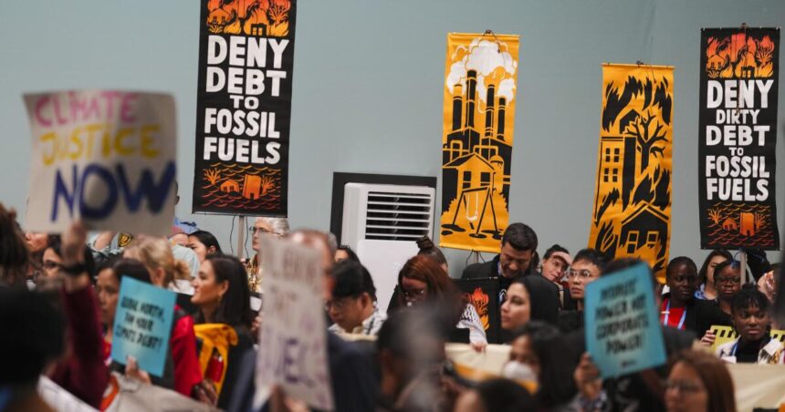 Protesters gather at U.N. climate talks in global day of action as progress on a deal slows