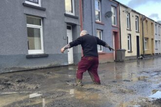 Hundreds of homeowners in England and Wales battle floodwaters after weekend storm