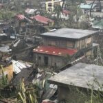 Typhoon lashes the Philippines, causing tidal surges and displacing massive numbers of people