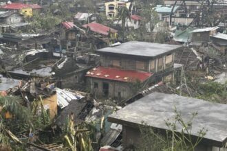 Typhoon lashes the Philippines, causing tidal surges and displacing massive numbers of people