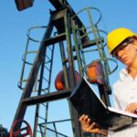 White female supervisor working at an oil rig