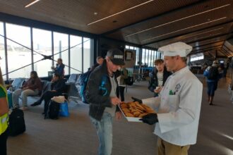 First Frontier Airlines flight from Denver arrives in Eagle County with cookies, swag and union pilots threatening to strike