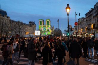 The Latest: The famed Notre Dame Cathedral in Paris reopens to great fanfare