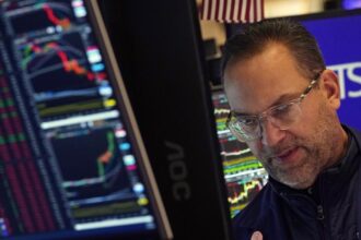 Wall Street ends little changed after giving up a big morning gain